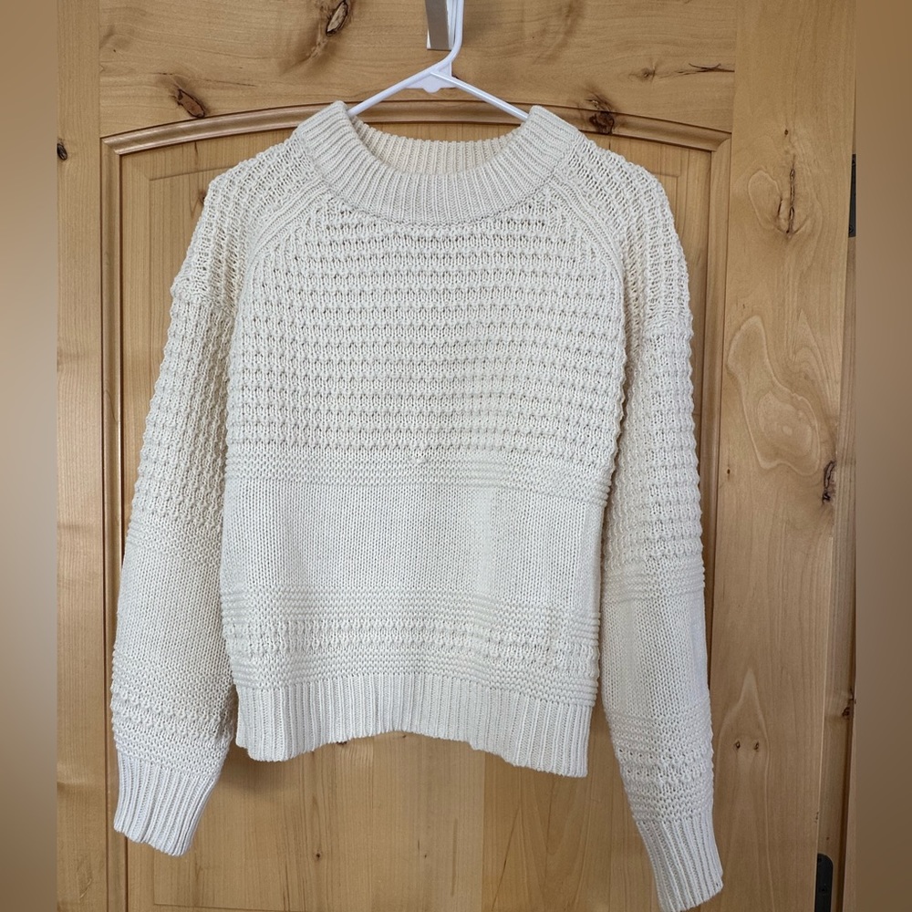 Details on this cream sweater!